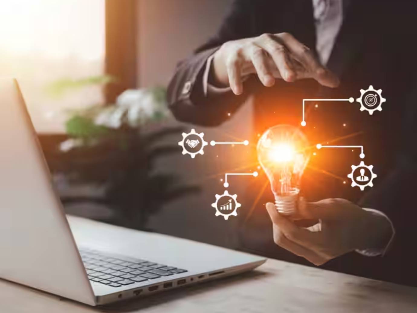 Close-up of a businessman holding a lightbulb, surrounded by graphics depicting technology